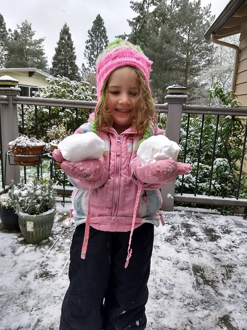 Little Kid Weighing Snow